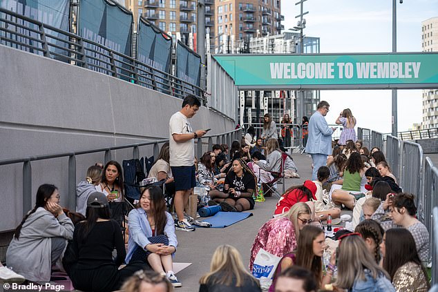 Fans queued outside Wembley Stadium today ahead of tonight's concert