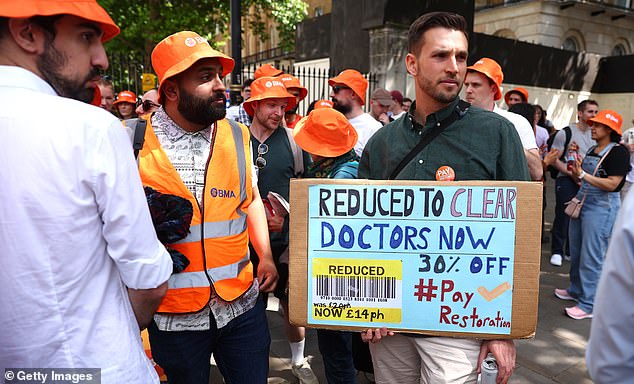 The new Health Secretary said striking would only 'punish' patients, adding that the government wants to work with medical staff to 'rebuild the NHS' (pictured: striking junior doctors in June)