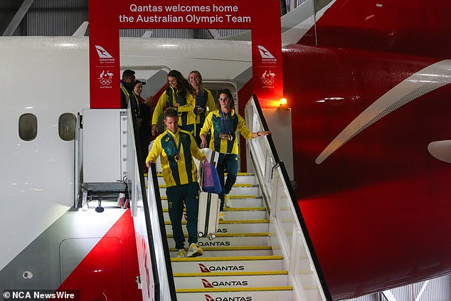 The tired Australians slept mostly on their Qantas flight back home after the Olympic Games in Paris