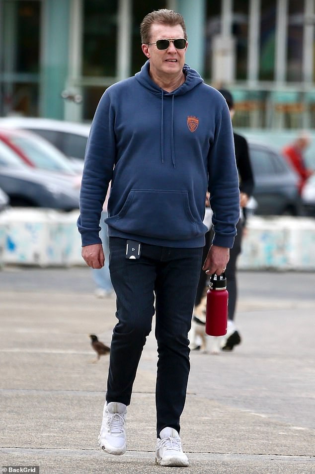 The TV journalist opted for a very casual look and made sure the spotlight was on his eldest child as he donned a simple navy sweater with black skinny jeans