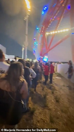 Videos obtained by DailyMail.com showed thousands of anxious spectators crowded outside the 18,000-seat arena