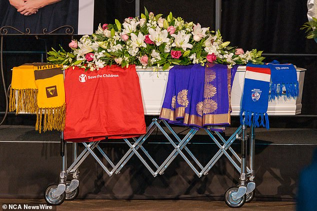 Scarves from AFL team Hawthorn and the Western Bulldogs also hung over her coffin