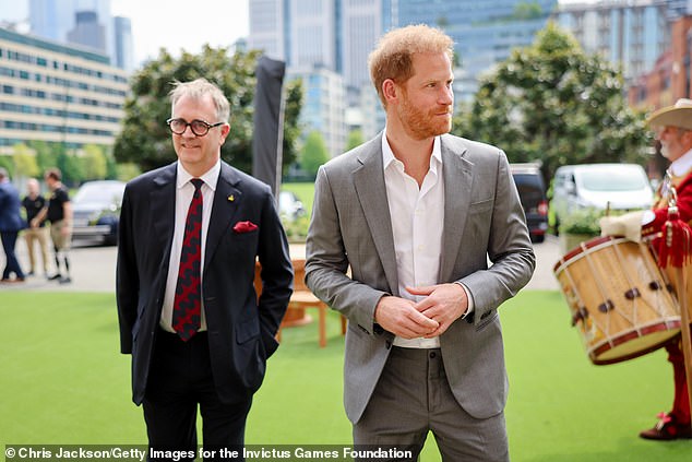 Dominic Reid, Director of the Invictus Games Foundation, and Prince Harry at the Honourable Artillery Company in London in May