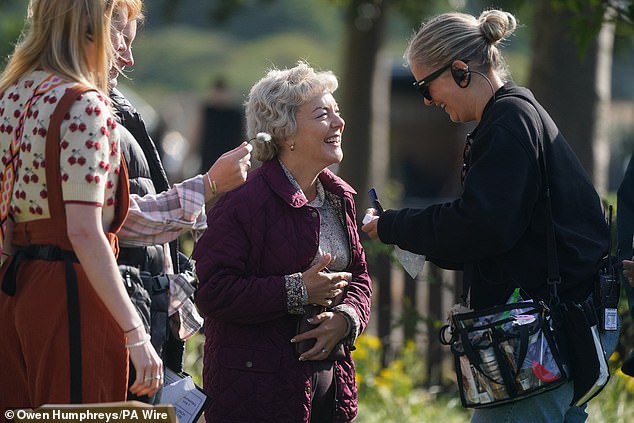 On set on Friday, Sheridan laughed as her hair and makeup were touched up