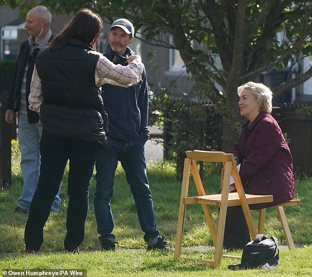 She then sat there happily listening as her fellow players talked among themselves