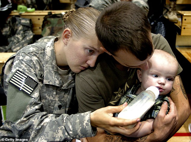 A member of the 82nd Airborne Division feeds her five-month-old child at Fort Bragg, North Carolina, where poverty, hardship and food insecurity are widespread