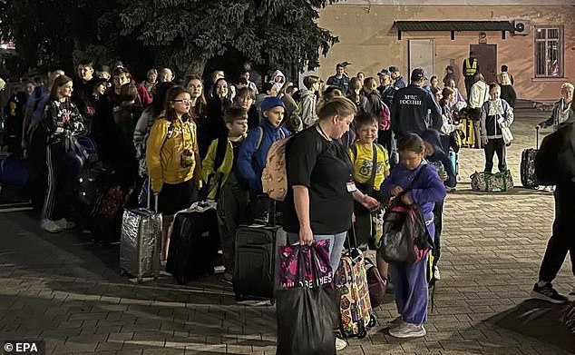 A handout photo provided by the press service of the Russian Emergency Situations Ministry shows evacuated people from the Belgorod and Kursk regions arriving at temporary reception points in Nevinnomyssk in Stavropolsky Kray, Russia