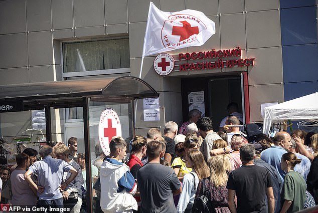 War refugees receive humanitarian aid at a Russian Red Cross distribution point in Kursk on August 15, 2024