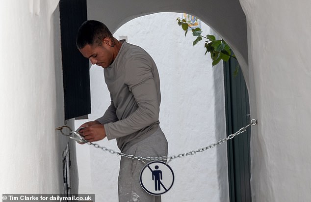 Residents of a Menorcan village dubbed 'Spanish Mykonos' deny they have declared 'war' on tourists by chaining their streets at night. A caretaker who attaches the chains across the lanes