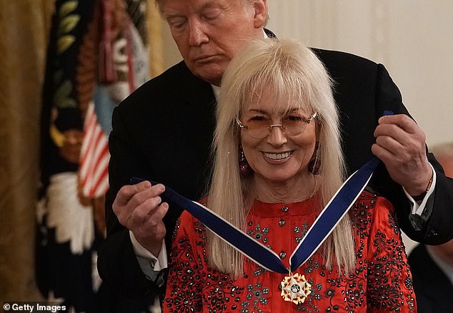 Trump (left) reminded the crowd how he awarded Miriam Adelson (right) the Presidential Medal of Freedom in 2018, slipping up and saying it was the equivalent of the Congressional Medal of Honor