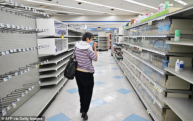 A woman browses the shelves at a Rite Aid in Alhambra, California on October 18, 2023. The store was set to close within days of announcing bankruptcy on October 15.