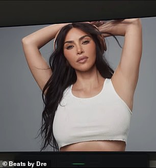 Kim wore a cropped white T-shirt as she posed sideways for the ad