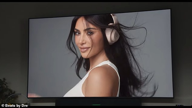 She poses like a storm as a wind machine blows her hair around in the ad, later finishing with her hands holding a cream-colored pair and a chocolate-brown pair