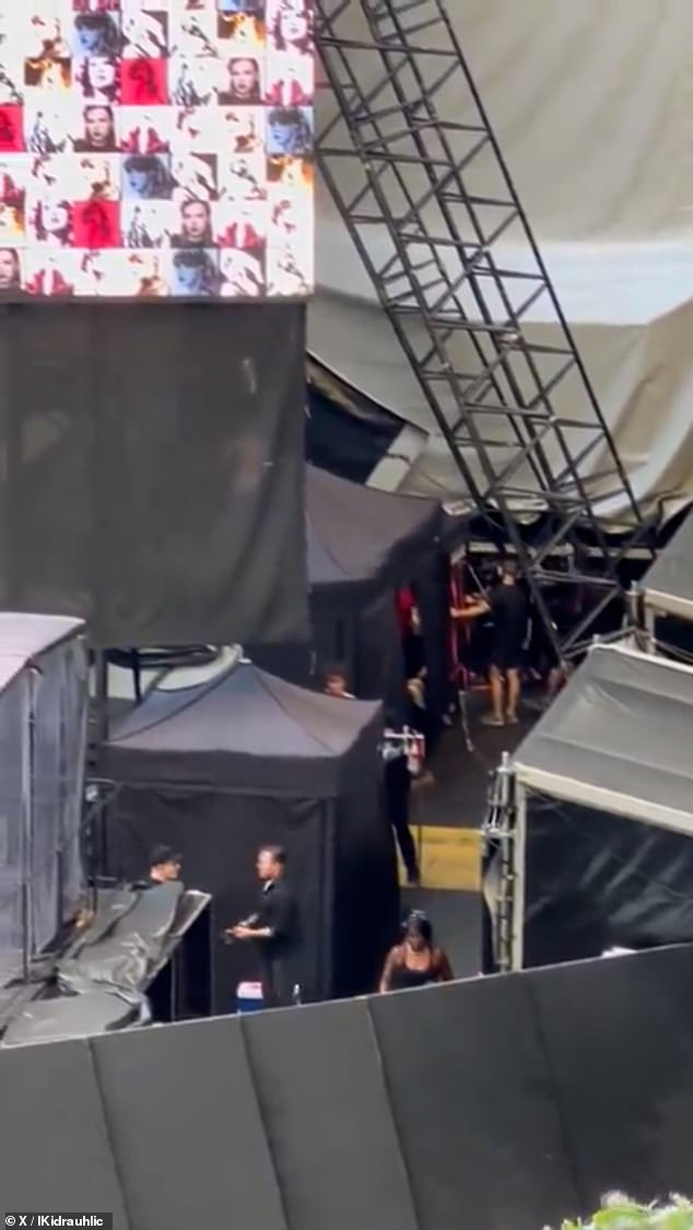 When it stopped, a very grainy shot of Taylor crawling out of the left side of the box and climbing up a few stairs before going on stage was seen