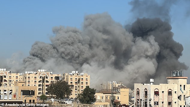 Smoke billows over Gaza on Friday after an Israeli attack. The US, Egypt and Qatar met this week to work on a hostage-taking ceasefire deal, which they hope to finalize in Cairo next week.