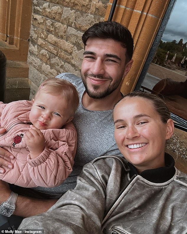 According to insiders, Molly-Mae, 25, became suspicious during Tommy's 2021 boxing training camp in Las Vegas with his brother, Tyson Fury (pictured with their daughter Bambi)