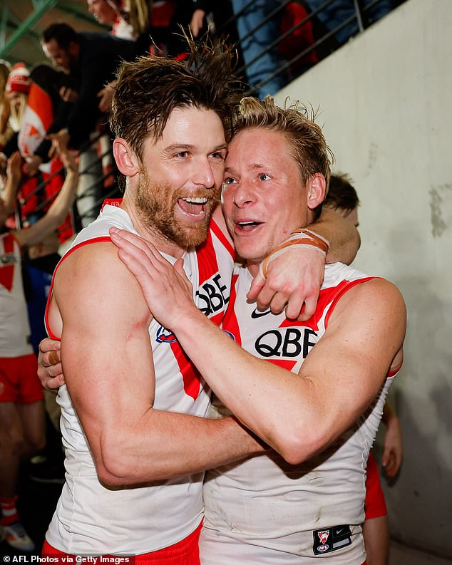 Swans' Dane Rampe and Isaac Heeney celebrate tying the AFL minor premiership