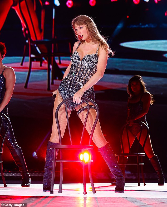 Taylor changed up her famous look by wearing a new black and sheer sequin bodysuit