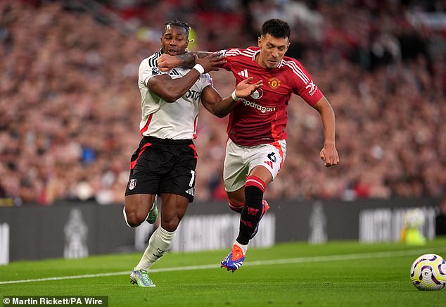 Martinez got the better of Adama Traore (left) in a physical battle down United's left flank on Friday