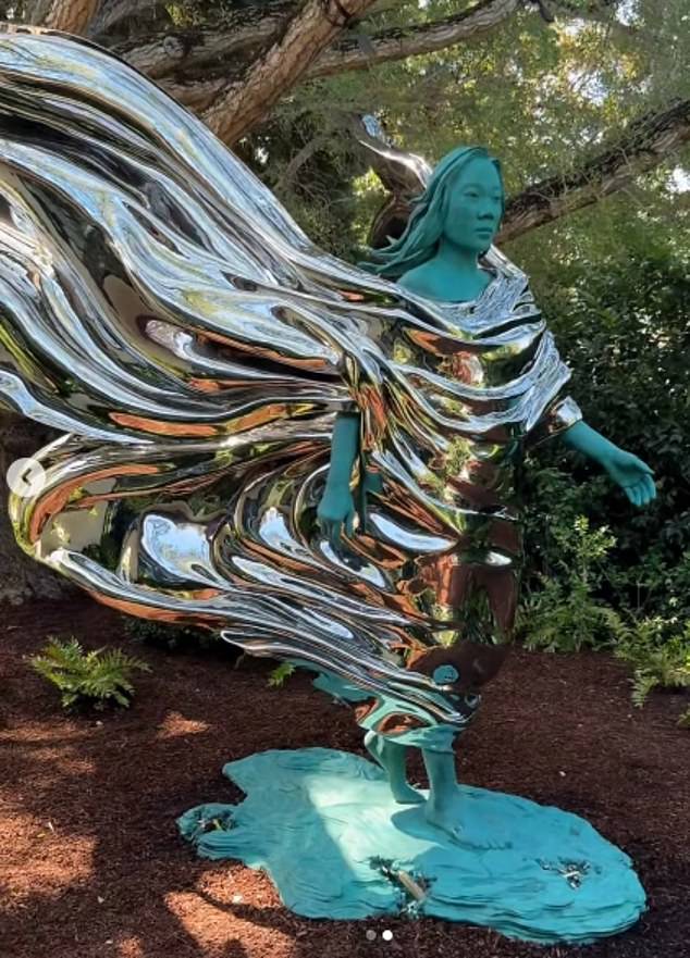 The statue appears to be made of green oxidized copper and polished stainless steel and quickly set social media alight