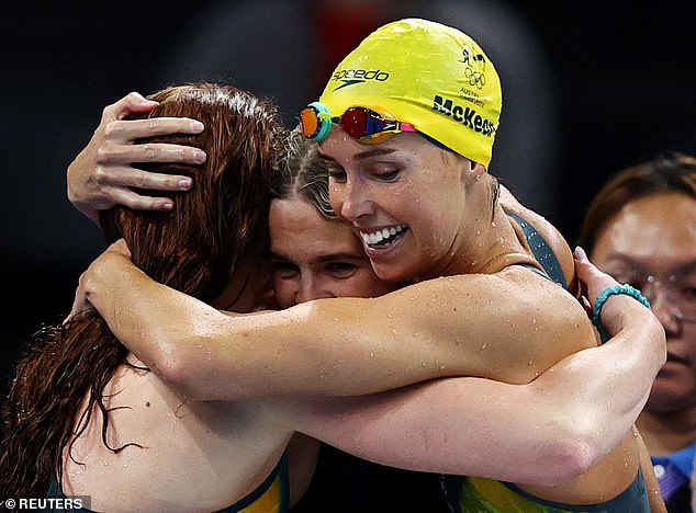 Emma McKeon (right) celebrates with her teammates Australia's victory in the 4x100m freestyle relay at the Paris Olympics.