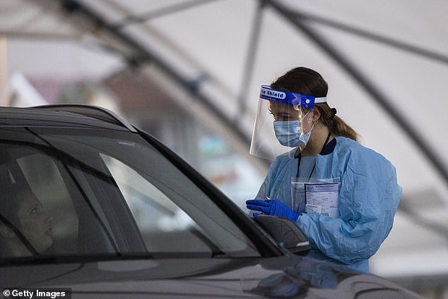 Queensland's Chief Health Officer John Gerrard said childhood vaccination rates had started to decline towards the end of the public health response to the Covid pandemic. An Australian healthcare worker wearing PPE is pictured