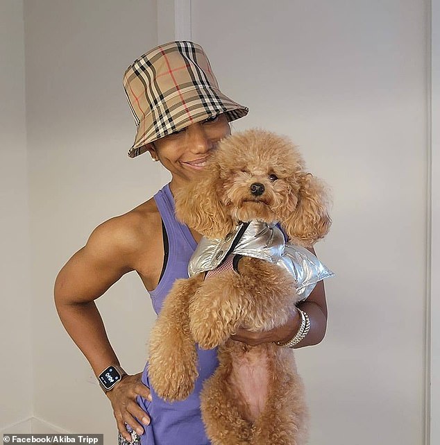 Personal trainer Akiba Tripp with her seven-pound toy poodle Baby who was killed by Syko near the bookstore when the owner suddenly opened the door