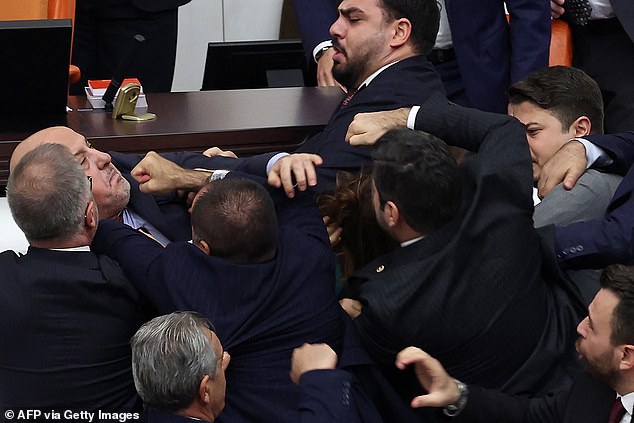 Dozens of delegates subsequently became involved in the melee, with drops of blood visible on the steps leading to the speaker's lectern