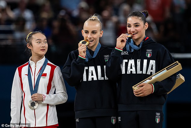 Yaqin went viral at the Olympics after she imitated her fellow podium finishers by biting her medal