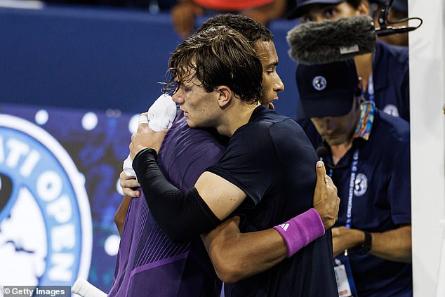 Auger-Aliassime eventually gave away the point as the two players embraced at the net