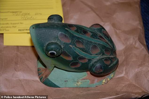 South Wales Police suspect that mother-of-five Leigh bashed his head in with a blunt object, believed to be an ornamental frog (above) - and then hid his body for years in her two-bedroom social housing unit in the village of Beddau