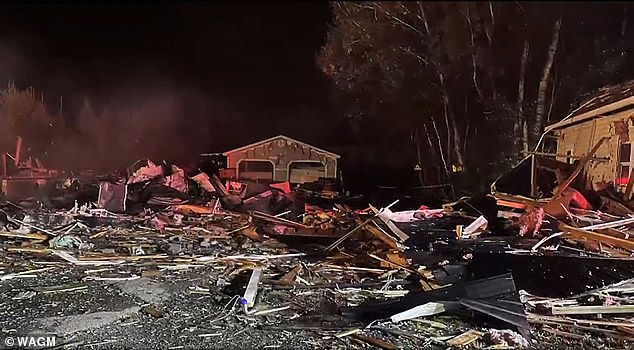 “I heard a bang and I felt like the basement floor was going to collapse and the roof was going to fall on me,” she said (pictured: debris from the explosion)