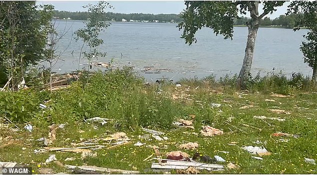 After the explosion, some of the debris landed in a nearby lake, pictured above