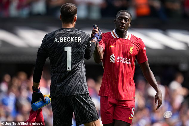 Ibrahima Konate (right, pictured with Alisson) came on as centre-back at half-time