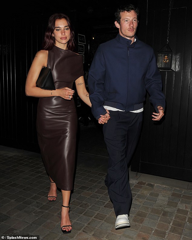 Meanwhile, Callum looked relaxed for their date night, wearing a navy bomber jacket with a high collar