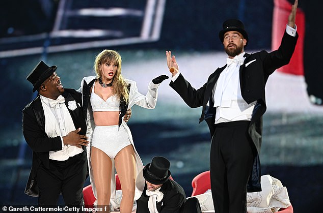 Looking ahead, they concluded that Monday's show, which featured a top hat, would see Taylor's boyfriend Travis Kelcee (R) return to Wembley (pictured on stage in June)