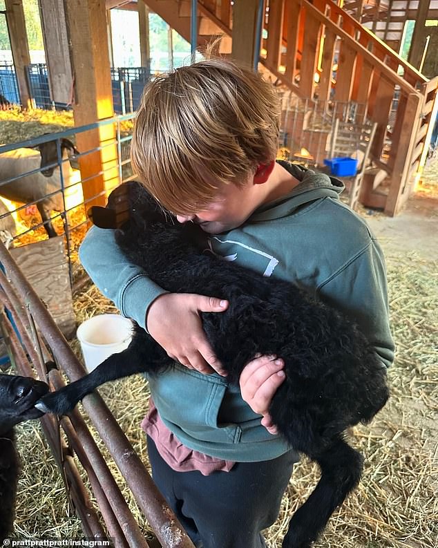 In another photo Pratt shared, his son held an adorable lamb