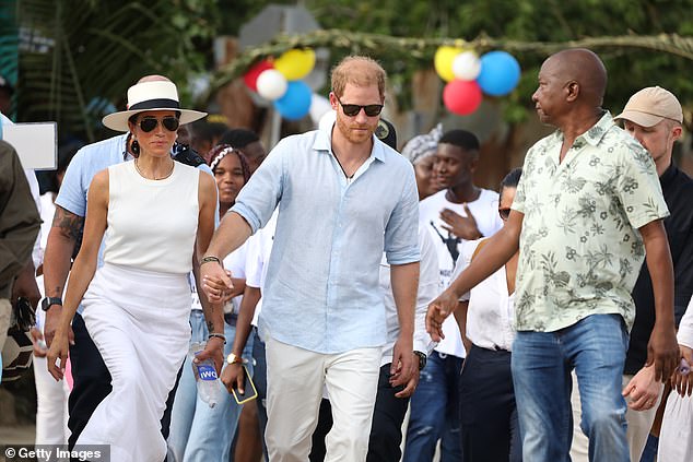 The Duke and Duchess of Sussex walk the streets on the third day of their visit