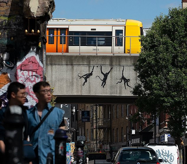 The third work to appear was a mural of three swinging monkeys in Brick Lane, London