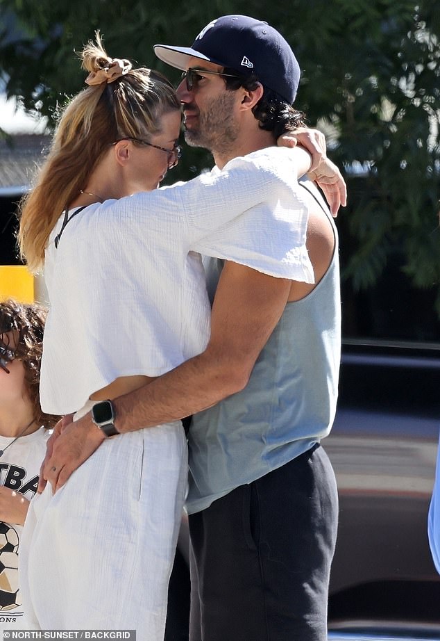 Justin Baldoni was spotted sharing a long kiss with his wife Emily on Saturday amid the fallout from behind-the-scenes tensions during production of It Ends with Us