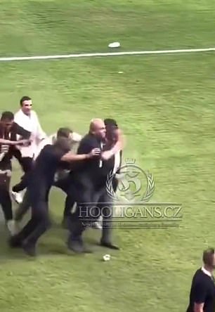 The Fenerbahce president got back up and managed to walk away without help, while being protected by security