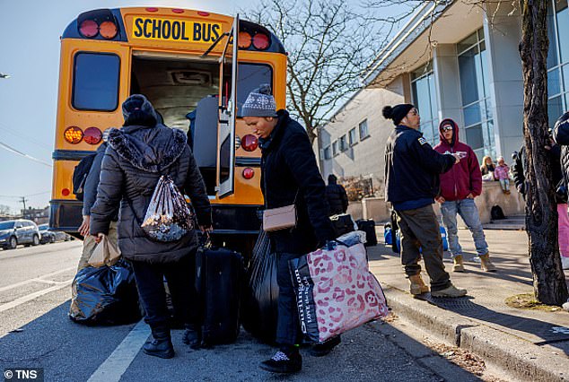 Venezuelan migrants board a bus in Chicago after recently arriving in the city