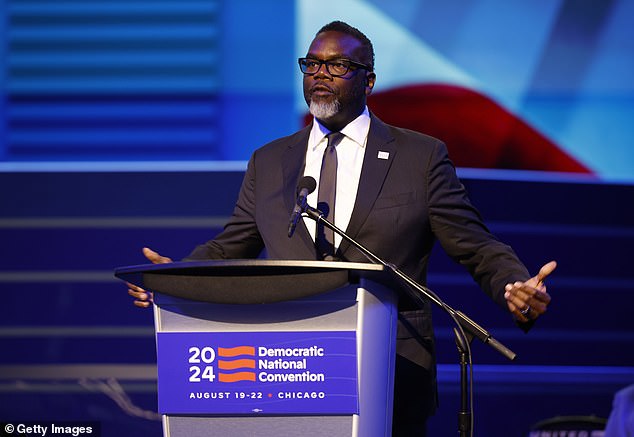 Chicago Mayor Brandon Johnson speaks on a podium unveiled ahead of the Democratic National Convention (DNC) at the United Center. His administration expected up to 25,000 migrants to arrive around the time of the convention