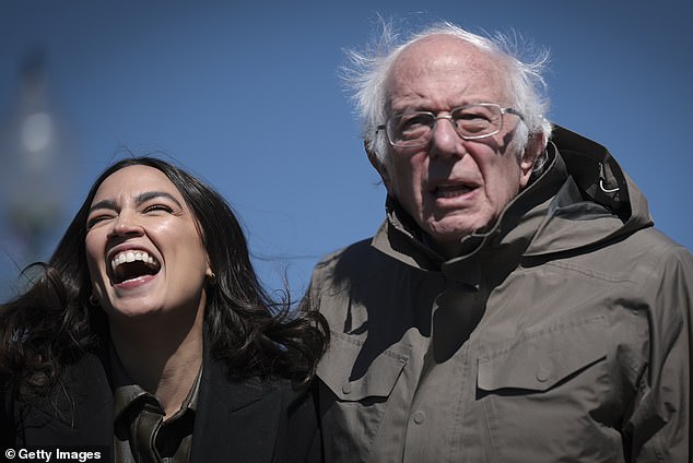 Rep. Alexandria Ocasio-Cortez (L) (D-NY) greets Sen. Bernie Sanders (R) (I-VT) outside Capitol Hill