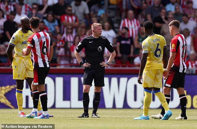 But the goal was disallowed by referee Samuel Barrott (centre) on his Premier League debut