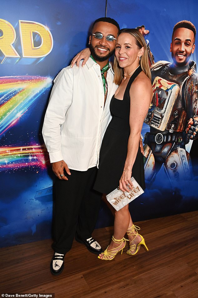 After the performance, Aston was spotted on the red carpet with his wife Sarah Richards, 40. They wore a white shirt, black trousers and white and black brogues.