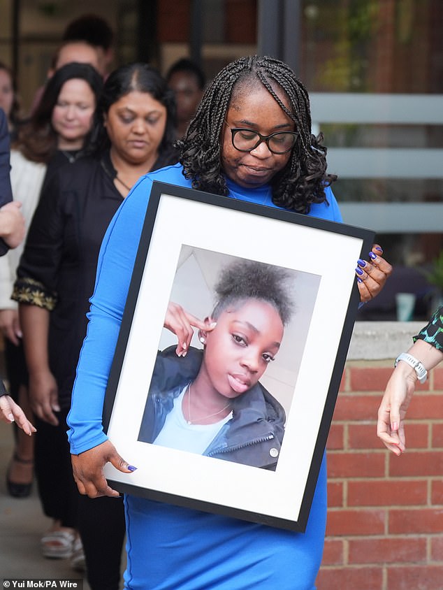 Hannah Jacobs - whose photo is held by her mother, Abimbola Duyile - died in February 2023 from an allergic reaction after drinking a hot chocolate at a Costa in east London. Dr Shirley Radcliffe noted that 'neither Hannah nor her mother had an EpiPen with them which had been prescribed'