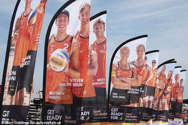 Van de Velde stands on flags with the rest of the Dutch team during the event