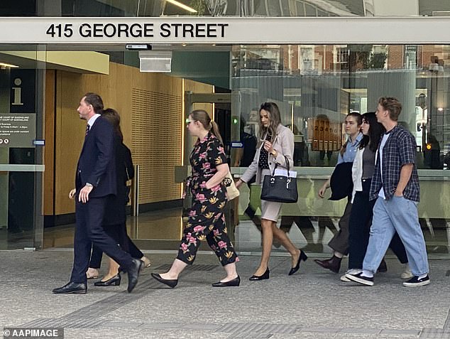 Dr Dunne's family (pictured leaving the courtroom) said they had lived in uncertainty for five years awaiting Hill's verdict.