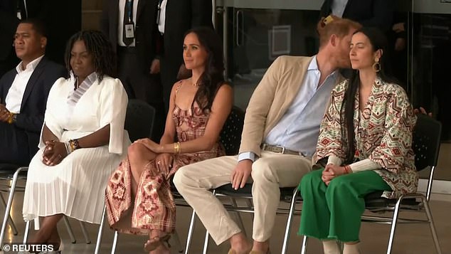 At one point during the performance, Prince Harry turned to someone off-camera to talk to them